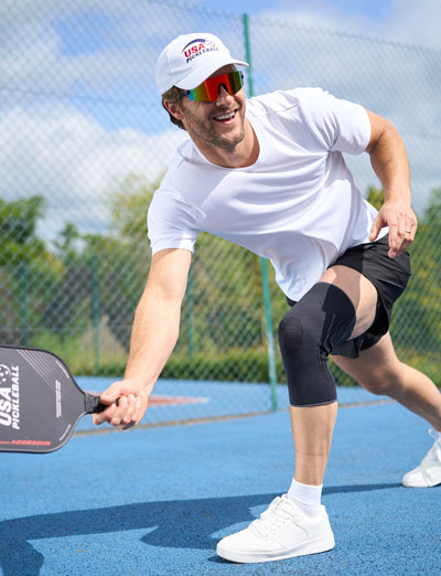A man wearing the Airflow React Knee Support playing Pickleball with USA Pickleball merchandise 