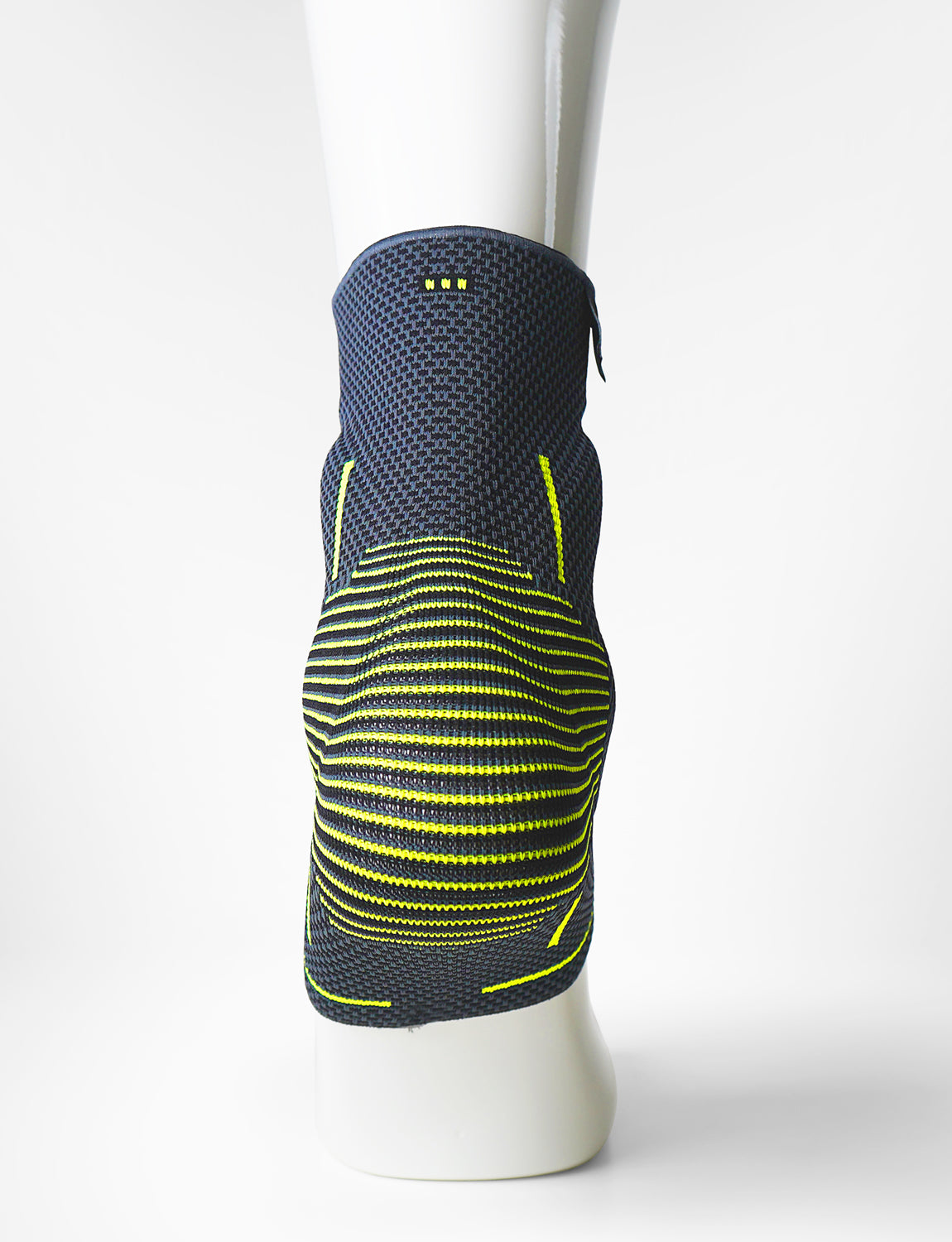 Foot mannequin wearing Neo G Active Plus Ankle Support back view