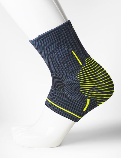 Foot mannequin wearing Neo G Active Plus Ankle Support left side showing integrated premium quality silicone joint cushion