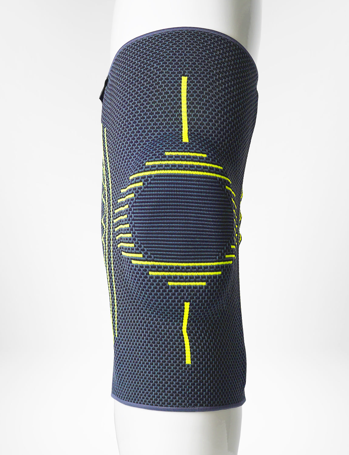 A close-up of a Neo G USA Active Plus Knee Support with blue knee brace with yellow accents and multi-zone compression, displayed on a mannequin leg against a white background.