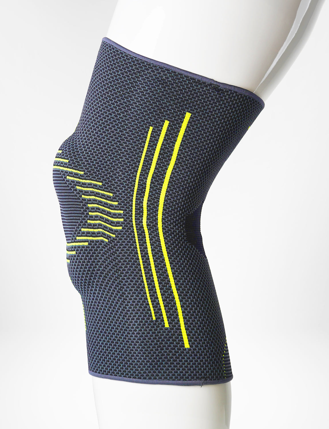 Leg mannequin wearing Neo G Active Plus Knee Support left side showing the silicone patella cushion