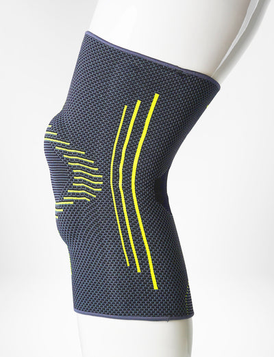 Leg mannequin wearing Neo G Active Plus Knee Support left side showing the silicone patella cushion