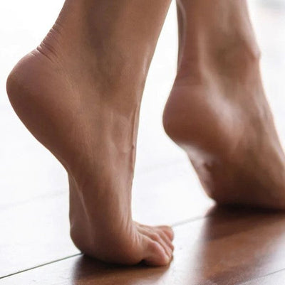 Woman's feet with heels lifted