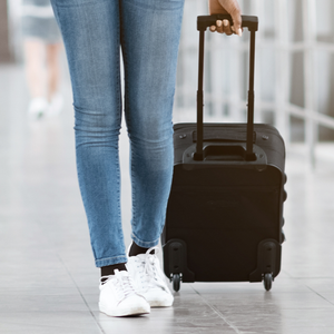 Woman walking with luggage case
