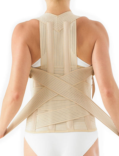 Woman wearing Neo G Dorsolumbar Support/Brace facing back, highlighting adjustable straps on the back