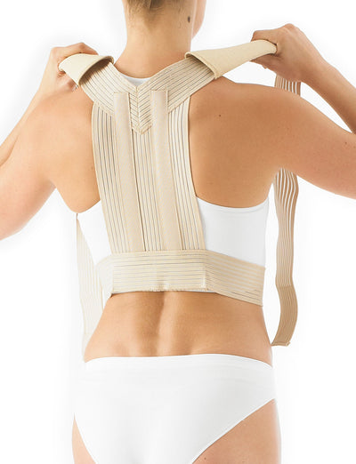 Woman wearing Neo G Clavicle Brace (Posturex) facing back highlighting adjustable straps on the shoulders