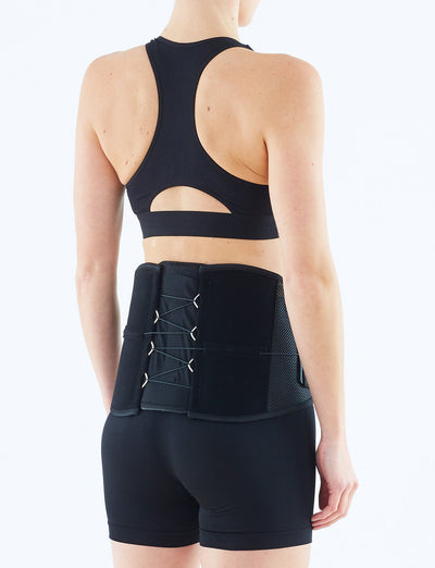 Woman wearing Neo G Adjusta-Fit Back Brace facing back