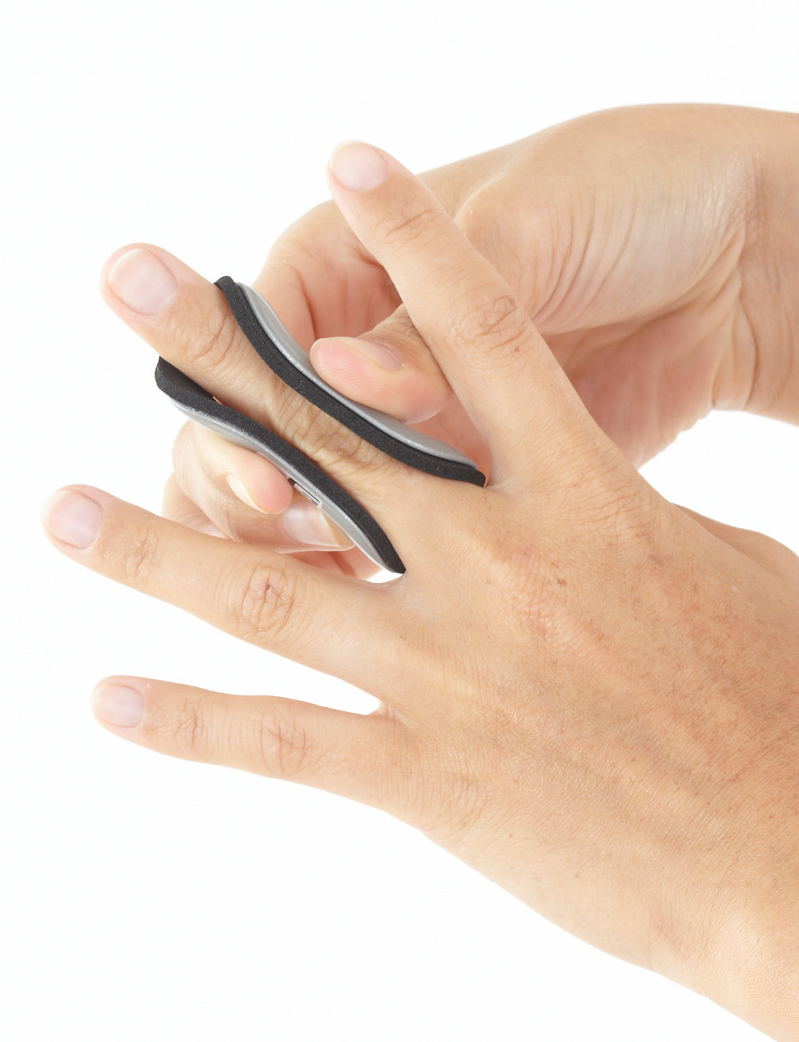 Hand with Neo G Easy-Fit Finger Splint on middle finger, top view, highlighting flexible shell