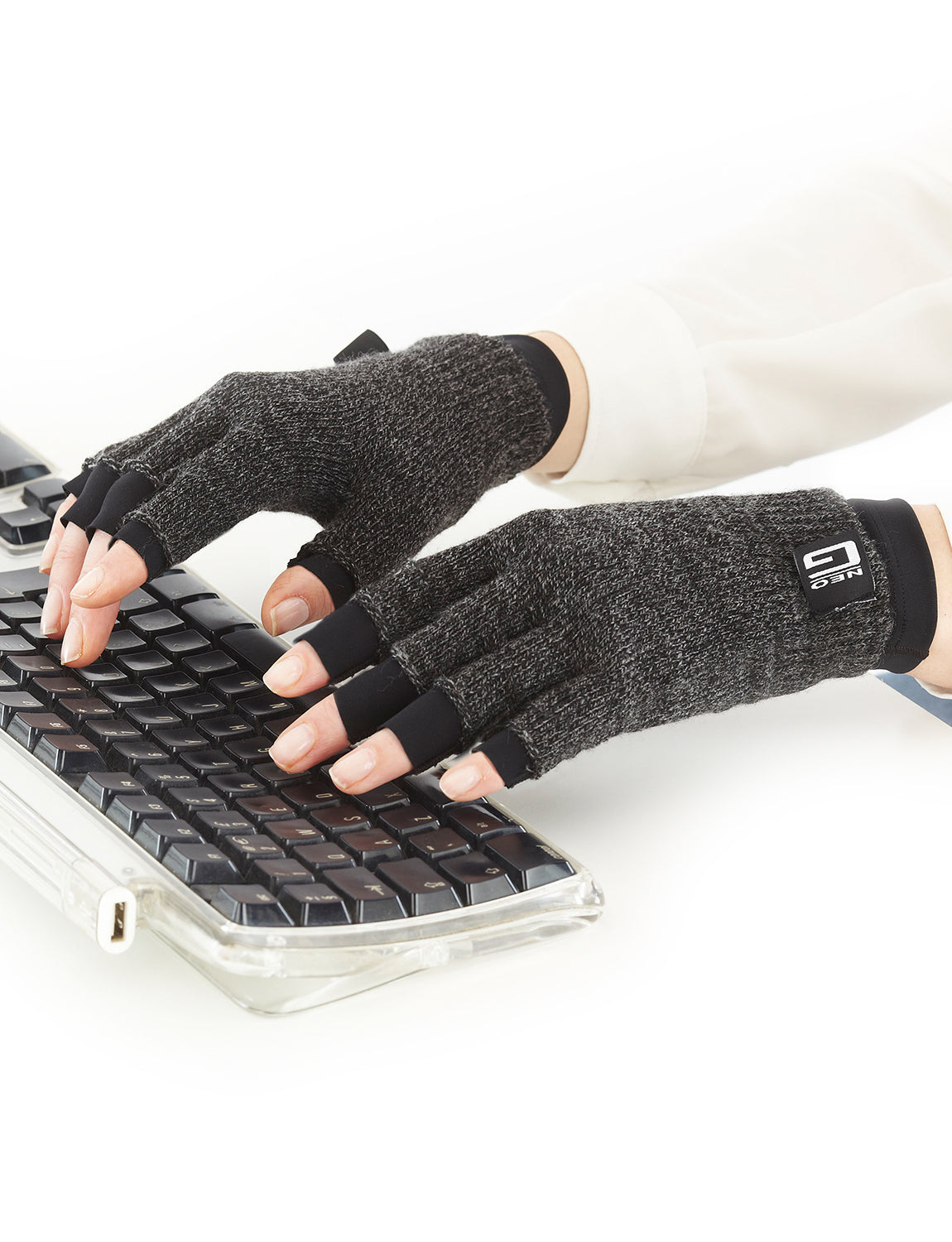 Pair of hands wearing Comfort/Relief Arthritis Gloves, typing