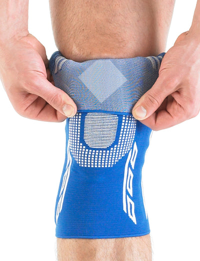 Back of knee with Neo G Airflow Plus Stabilized Knee Support with Silicone Patella Cushion folded down highlighting anti-slip diamond and knit fabric
