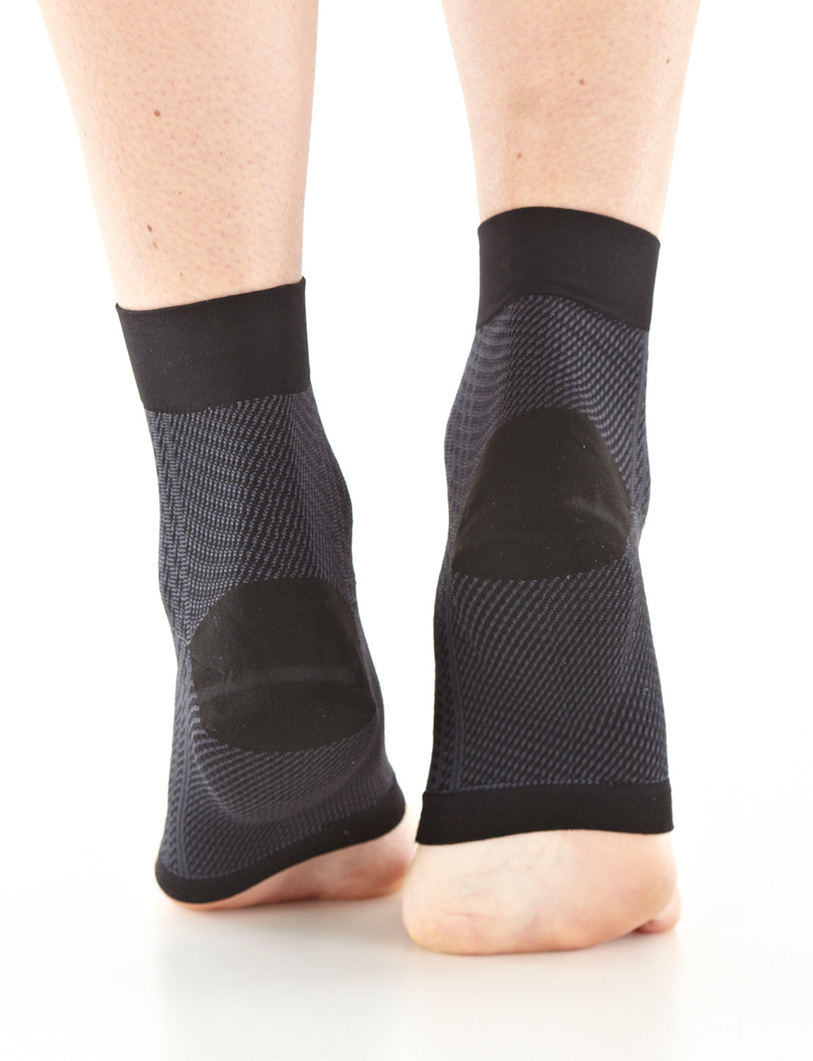 Pair of Feet wearing Neo G Plantar Fasciitis Everyday Support facing back