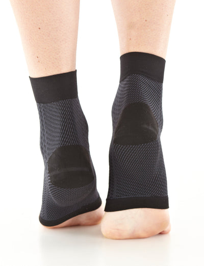 Pair of Feet wearing Neo G Plantar Fasciitis Everyday Support facing back