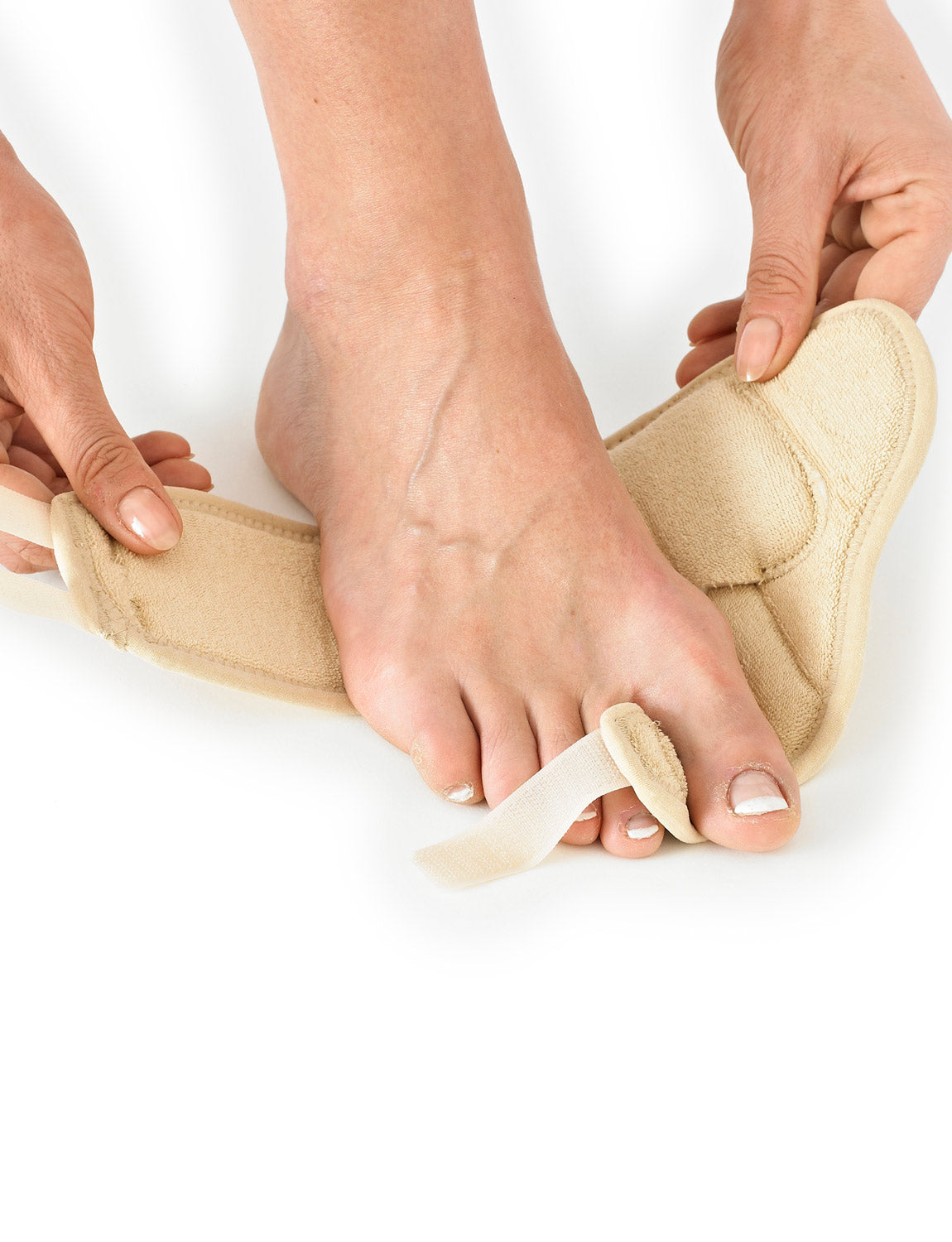Hands putting Neo G Bunion - Hallux Valgus Soft Support onto right foot highlighting adjustable big toe support