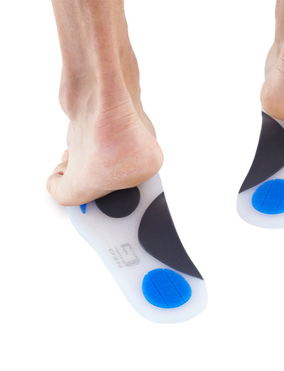 Pair of feet standing on Neo G NeoThotics Silicone Full Length Insoles