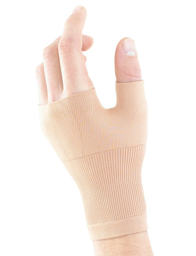 Hand wearing beige Neo G Airflow Wrist & Thumb Support palm down