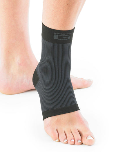 Pair of feet with one wearing black Neo G Airflow Ankle Support facing front