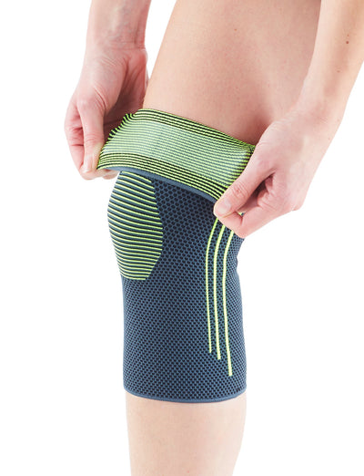 Leg wearing Neo G Active Knee Support with top folded to show anti-slip band