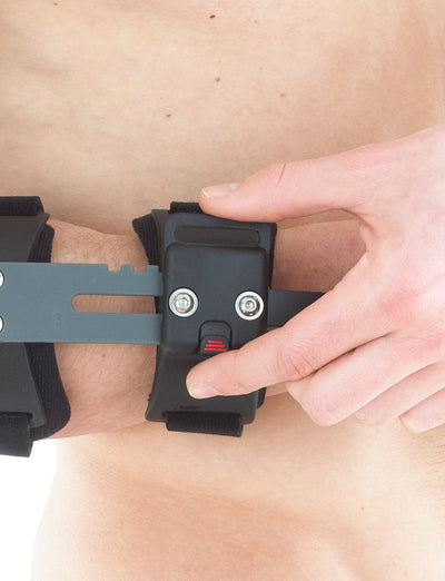 Man wearing Neo G Post Operative Elbow Brace highlighting 5 adjustable length levels control