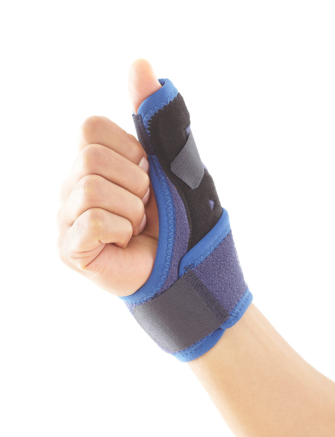 Hand wearing Neo G Easy-Fit Thumb Brace in fist with thumb extended