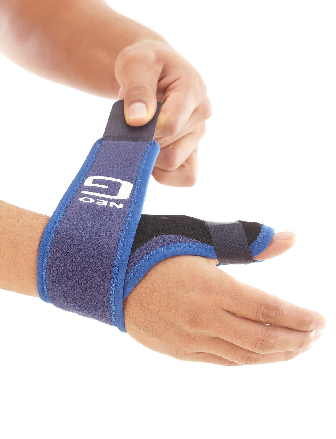 Hand wearing Neo G Easy-Fit Thumb Brace palm down highlighting adjustable wrist strap