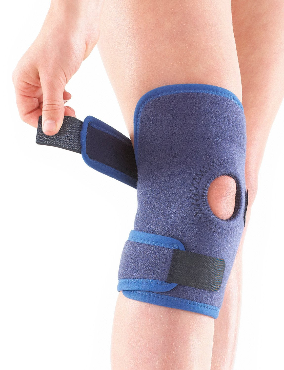 Child wearing Neo G Kids Open Knee Support, facing front, highlighting the adjustable strap
