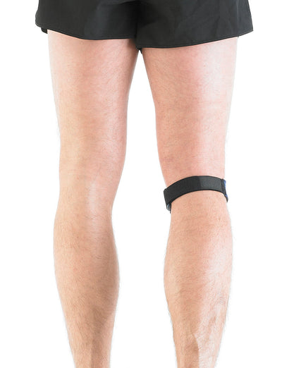 Man wearing Neo G Patella Band below knee, facing back