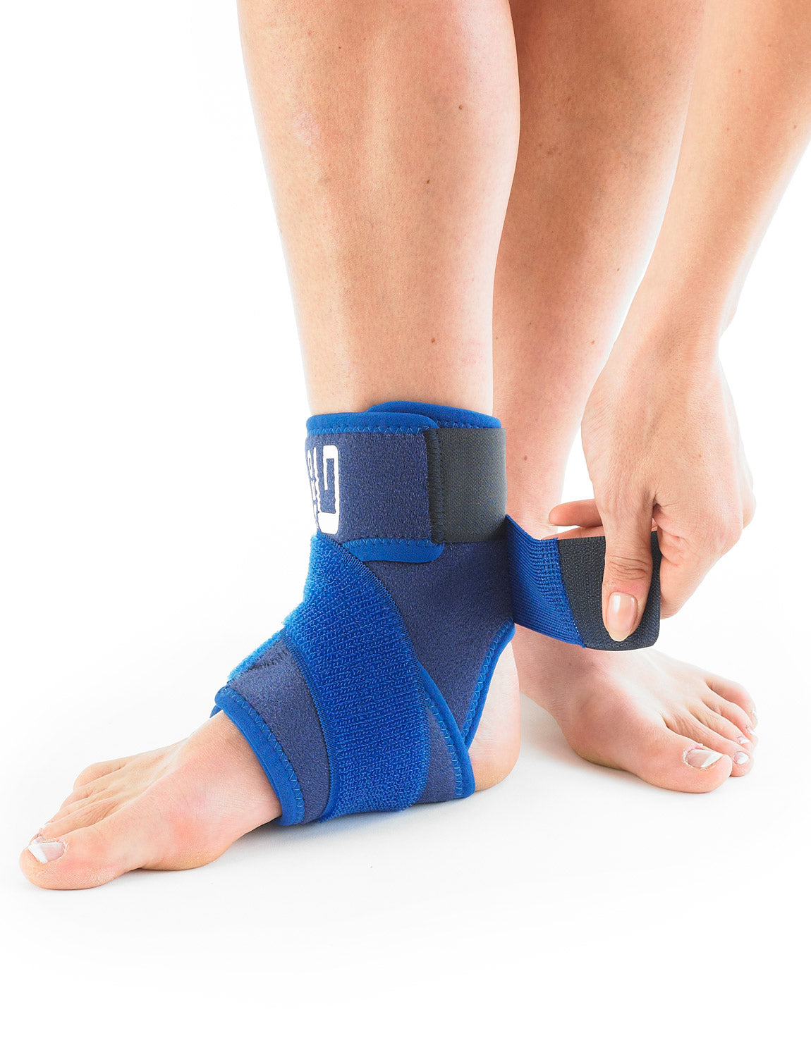 Pair of feet, one wearing Neo G Ankle Support highlighting adjustable Figure of 8 Strap