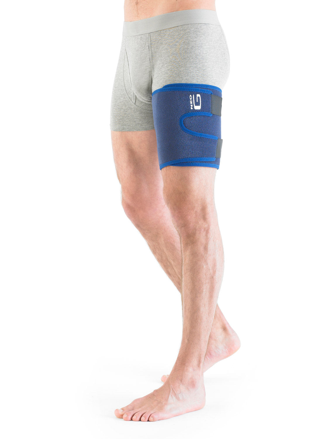 Man wearing Neo G Thigh and Hamstring Support on left leg facing front, stepping forward
