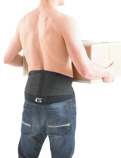 Man wearing Neo G Back Brace with Power Straps facing back holding a box