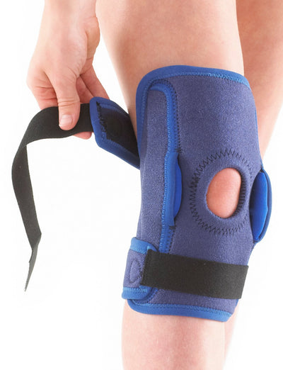 Child wearing Neo G Kids Hinged Knee Support, highlighting adjustable straps