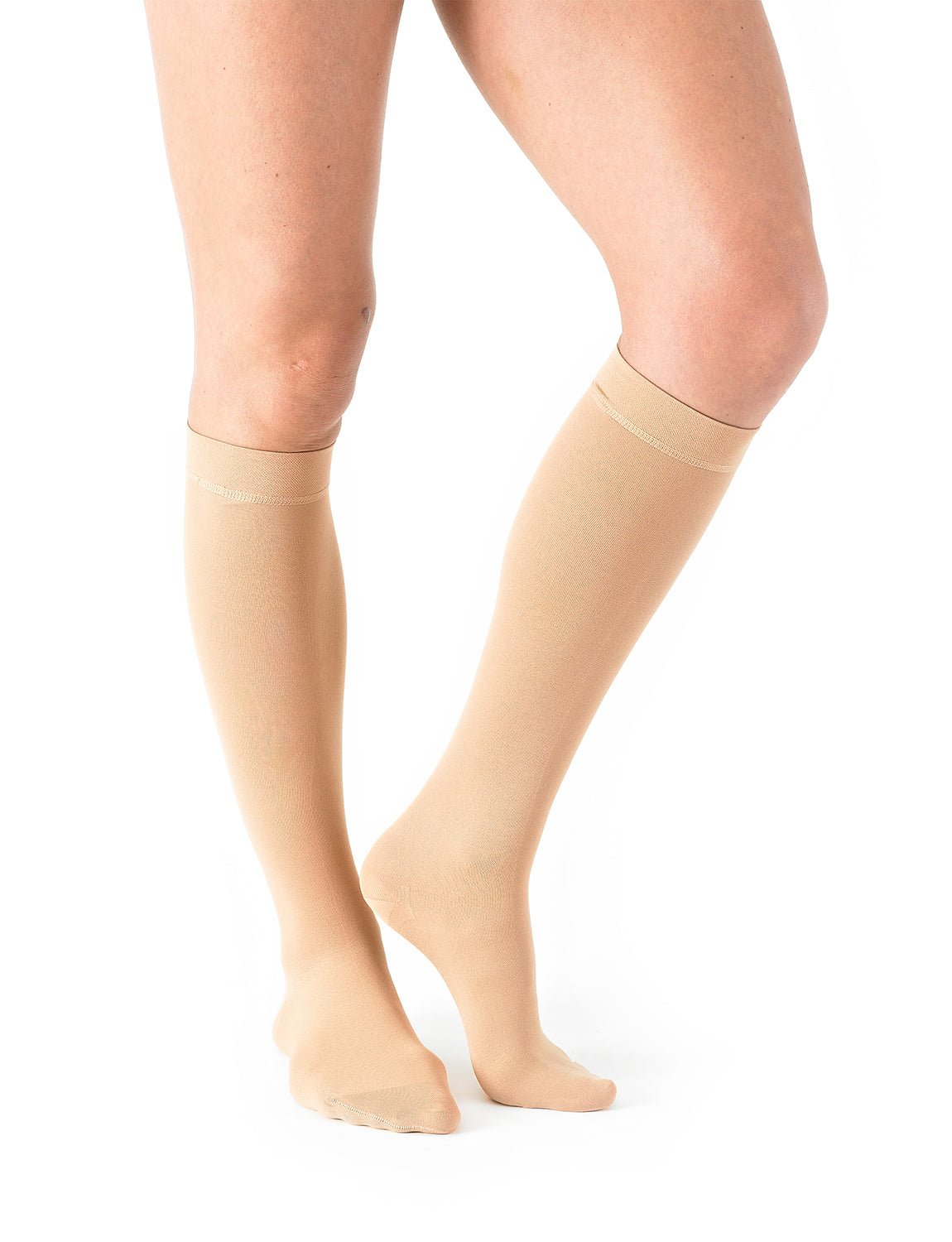 Woman wearing Beige Neo G Therapeutic Knee Highs (Closed Toe) showing comfort top band