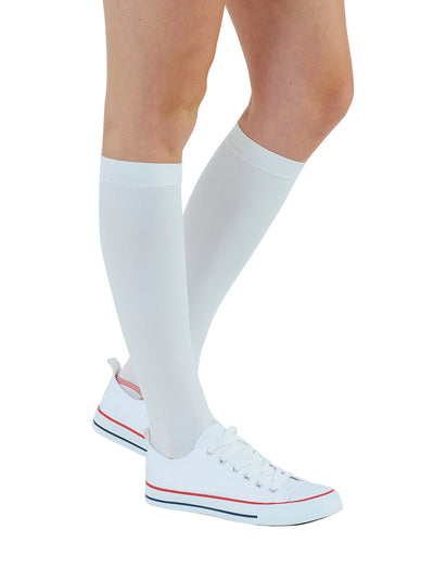 Woman wearing White Neo G Anti-Embolism Knee Highs (Closed Toe) with sneakers