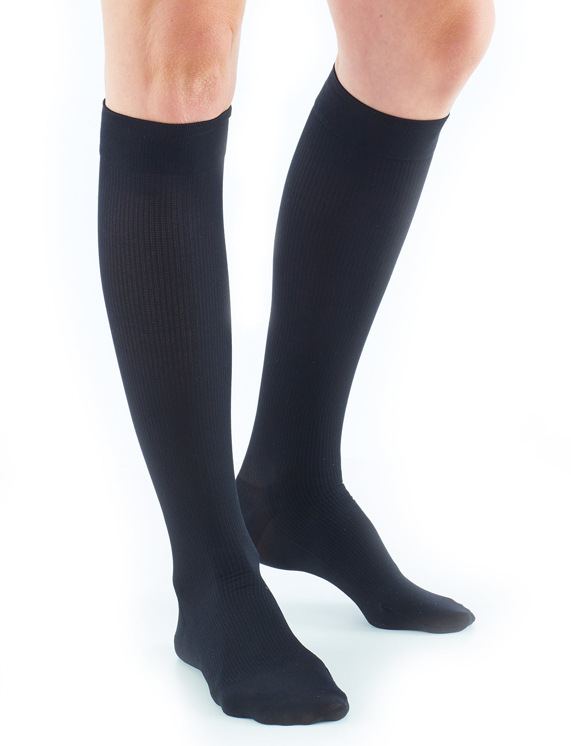 Woman wearing Neo G Energizing Dress Socks, facing front, showing comfort top band
