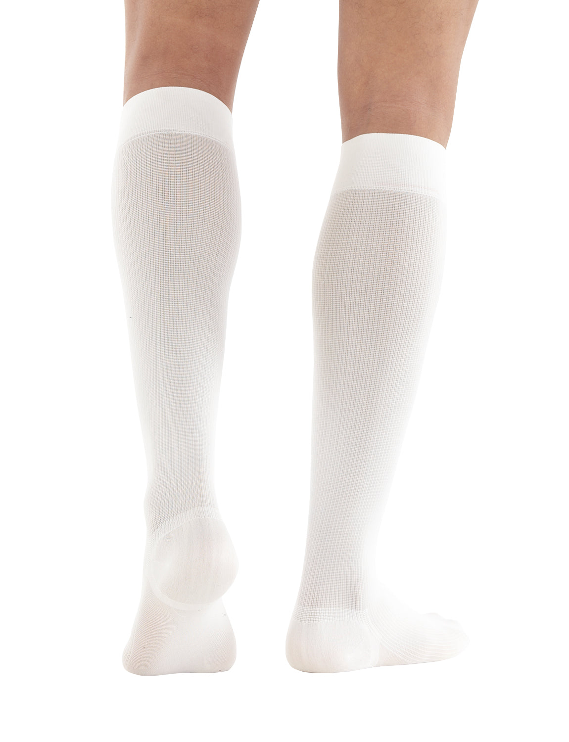 Woman wearing White Neo G Energizing Dress Socks facing back, showing shaped heel cup
