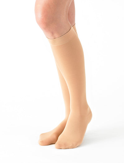 Woman wearing Beige Neo G Energizing Comfort Sheer Knee Highs showing comfort top band