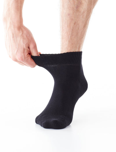Foot wearing Black Neo G Comfort Socks Diabetic Friendly highlighting the gentle top to alleviate tightness