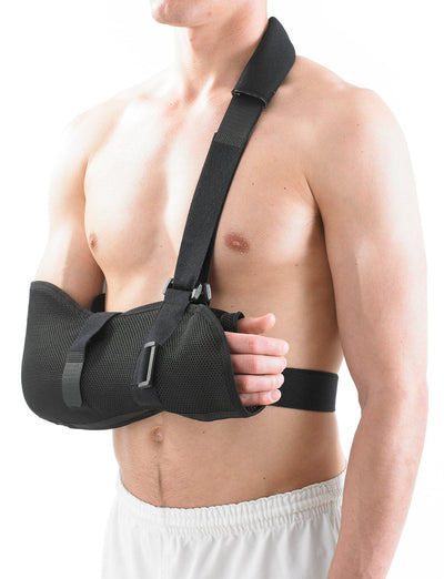 Man wearing Neo G Airflow Breathable Arm Sling, facing side, showing adjustable shoulder strap